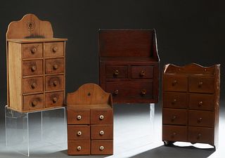 Group of Four Wooden Wall Cabinets, early 20th c., consisting of a pine spice cabinet with six labeled drawers; a mahogany example with eight small dr