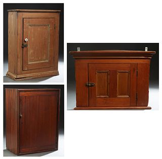 Group of Three Hanging Wall Cabinets, late 19th c., one a mahogany corner cabinet with a single door; a Louisiana Cypress medicine cabinet with a porc