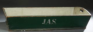 Louisiana Carved and Polychromed Pine Harvesting Basket, 19th c., the short sides with hand holes, in green paint, with "JAS" initials painted on one 
