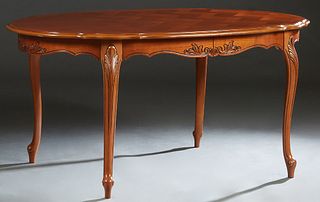 French Louis XV Style Carved Cherry Dining Table, 20th c., the stepped parquetry inlaid serpentine edge oval top, over a scalloped skirt, on cabriole 