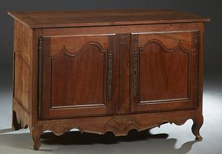 French Provincial Louis XV Style Carved Cherry Coffer, 19th c., the rectangular lifting top over a front with faux double arched panel cupboard doors 