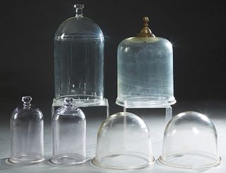 Group of Six Thick Glass Display Domes, early 20th c., four with handles on top, Largest- H.- 17 in., Dia.- 9 in. (6 Pcs.)