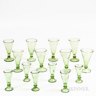 Fourteen Pieces of Green Blown Glass Drinkware