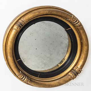 Regency Giltwood and Part-ebonized Convex Mirror, four-section frame, each ending in leaf-form decoration and separated by rings, surrounding an eboni