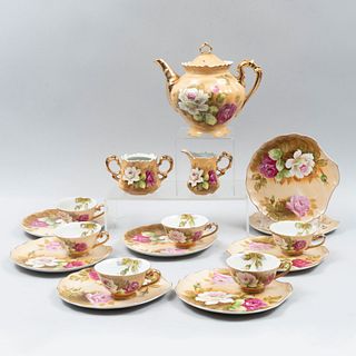 Juego de té. Japón SXX Elaborado en porcelana Lefton. No. Serie 1864 Consta de: tetera, cremera, azucarera y 6 ternos. Piezas: 15