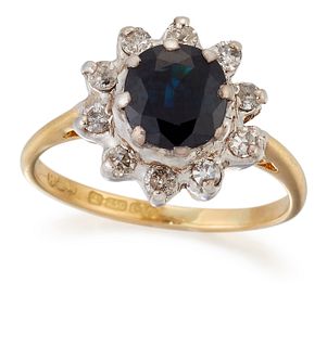 AN 18 CARAT GOLD SAPPHIRE AND DIAMOND CLUSTER RING, a round