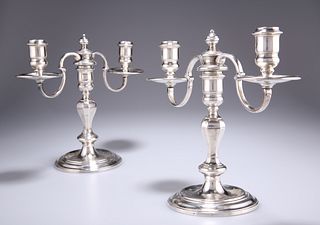 A PAIR OF SILVER-PLATED TWO-LIGHT CANDELABRA, by Garrard & 