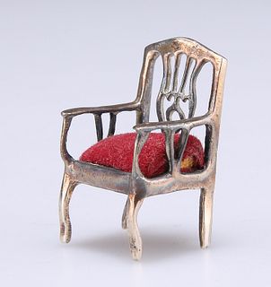 A NOVELTY PIN CUSHION, in the form of a chair. 3cm high
