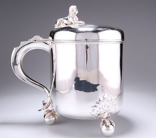 A VICTORIAN SILVER LIDDED TANKARD OF SUBSTANTIAL PROPORTION