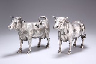 A PAIR OF SILVER MODELS OF CATTLE, CIRCA 1900-1910,?realist