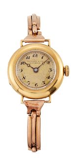 A TIFFANY & CO 18 CARAT GOLD LADY'S WRISTWATCH, case with i