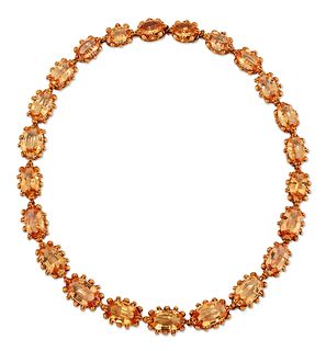 A TOPAZ RIVIERE NECKLACE, graduated oval-cut orange-yellow 