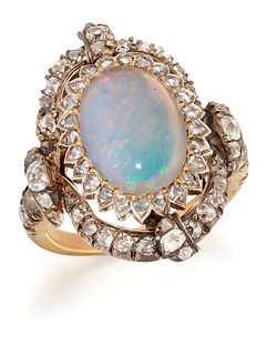 A LATE VICTORIAN OPAL AND DIAMOND CLUSTER RING, an oval-cut
