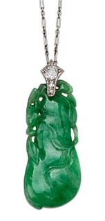 A JADE AND DIAMOND PENDANT ON CHAIN,?a jade pendant carved 