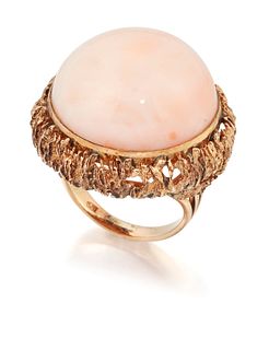 A 1970s CORAL COCKTAIL RING, a large round pink coral in a 