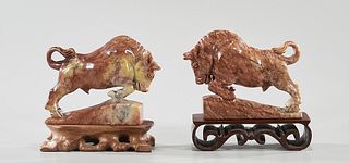 Two Carved Soapstone Bulls
