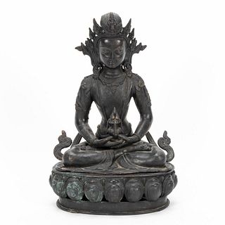 SINO-TIBETAN PATINATED FIGURE OF A SEATED AMITHAY