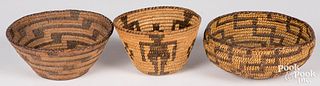 Three Southwestern coiled baskets, one having huma