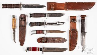 Four fixed blade knives and sheaths