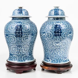 Near Pair of Blue and White Jars and Covers