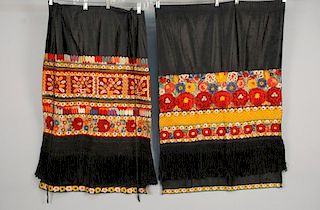 TWO ETHNIC POLYCHROME EMBROIDERED APRONS, MID 20th C.