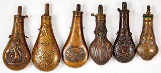 Collection of six brass powder flasks, 19th c.