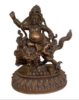 Copper AlloyPatinated copper alloy image of Kubera (also known as White Jambhala), the Hindu and Buddhist god of wealth, riding on the back of a drago