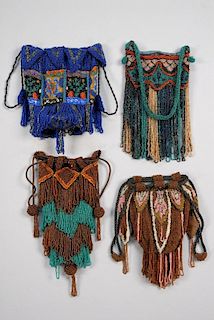 FOUR ART DECO FRINGED BEADED BAGS.