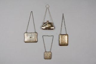 FOUR STERLING SILVER PURSES or COMPACTS, 1910s - 1930s.
