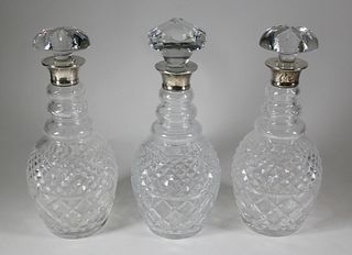 Three Clear Crystal Decanters with Sterling Collars