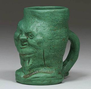 Wheatley Pottery Matte Green Face Mug c1910