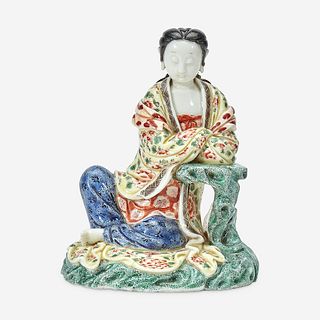 A Chinese enameled Dehua porcelain figure of Guanyin seated 18th Century, later decorated