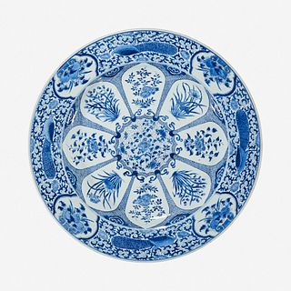 A large Chinese blue and white “Peacock and Rosette” charger Kangxi period