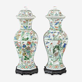 A pair of Chinese famille verte-decorated octagonal baluster vases and covers Kangxi period