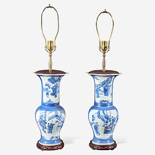 A pair of Chinese blue and white powder-blue ground “Phoenix-tail” vases mounted as lamps Kangxi style