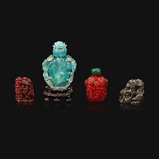 A Chinese carved aquamarine snuff bottle, an amber lion-form seal, and an amber snuff bottle Qing Dynasty