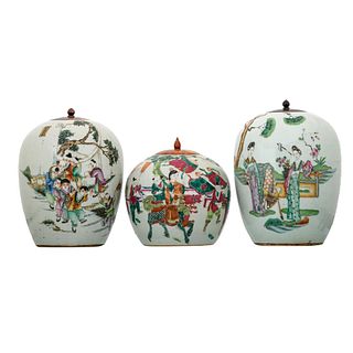 THREE CHINESE FAMILLE-ROSE ‘FIGURES’ JARS AND COVERS