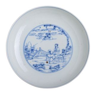 A CHINESE BLUE AND WHITE ‘FIGURES’ DISH