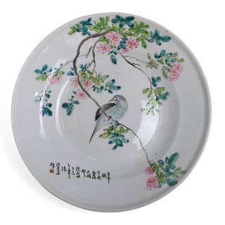 A CHINESE FAMILLE-ROSE ‘FLORAL AND BIRD’ DISH