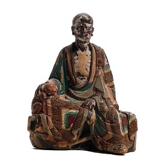 A CLAY FIGURE OF A LUOHAN