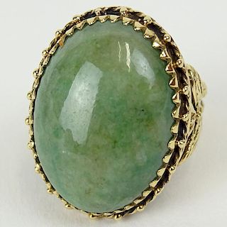 14 Karat Yellow Gold and Green Jade Ladies Ring with Filigree Work, Size 5-1/4. Signed 14K on Cartouche.