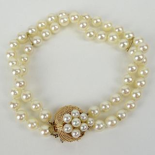 Retro 14 Karat Yellow Gold and Double Strand Pearl Ladies Bracelet with Safety Lock. Signed K14.