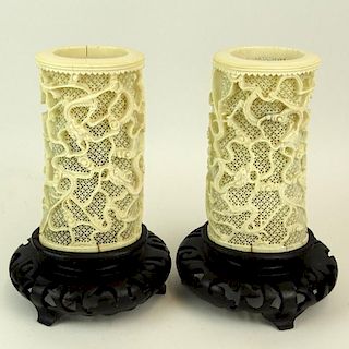 Pair of Chinese Intricately Carved Reticulated Ivory Vases Mounted as Lamps on Carved Wood Bases.