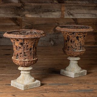 Pair of Pierced Cast Iron Trellis and Campagna Form Urns on Stone Bases