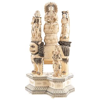 GUAN YIN GODDESS WITH GENERAL GUAN YU, LADY OF THE COURT ON FOO DOG AND PRISONER CHINA, 20TH CENTURY Carved and inked ivory 27.5 x 14.1 x 9.8" (70 x 3