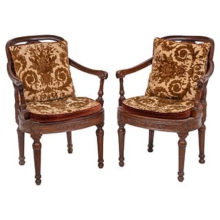 PAIR OF ARMCHAIRS 20TH CENTURY Carved wood with bejuco on backs and seats, upholstered cushions with floral motifs 33.8 x 19.6 x 21.6" (86 x 50 x 55 c