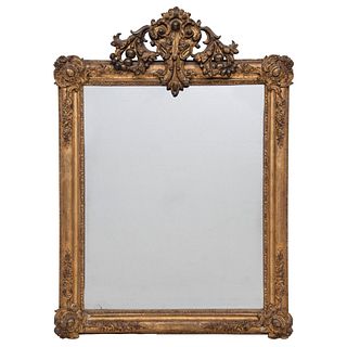 MIRROR 20TH CENTURY Made of carved wood, gilded and decorated with floral motifs Metallic finish with acanthus leaves 40.9 x 18.1" (104 x 46 cm)