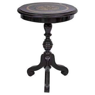AUXILIARY TILT-TOP TABLE 20TH CENTURY Ebonized wood; circular cover with mother-of-pearl shell applications, carved shaft 29.1 x 22" (74 x 56 cm)