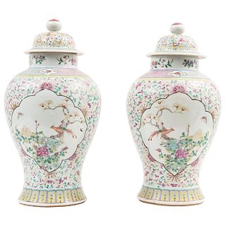 PAIR OF JARS Oriental Origin, Early 20th century Made of porcelain with floral, bird and organic motifs 17.7" (45 cm) tall