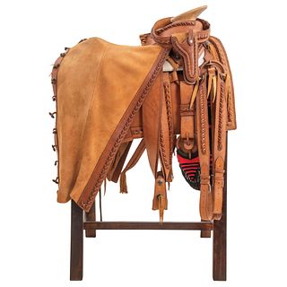 FAENA SADDLE MEXICO, 20TH CENTURY Complete set of smooth leather with braid trimmings
